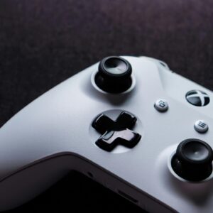 White Xbox controller close-up, highlighting buttons and design, perfect for gaming themes.